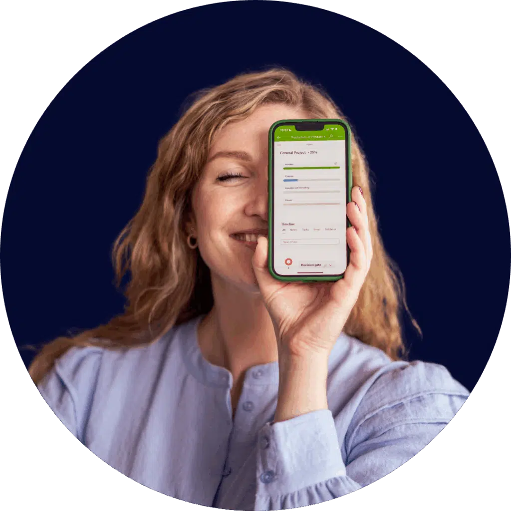 Smiling woman holding up a smartphone displaying a project overview in the Business Online system.